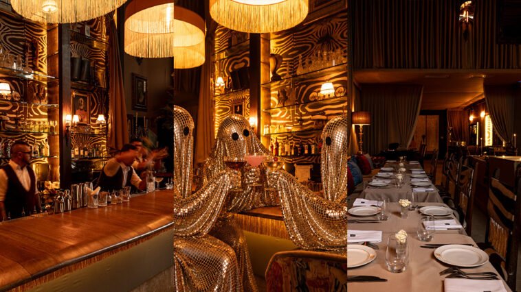 Montagem de ambientes do Maison Dodoma com bar iluminado, figuras decorativas espelhadas e mesa comprida posta para jantar.